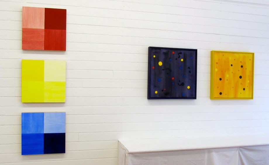 From left - ABC (1999), acrylic on panel, 16" x 16" each, and Dark Energy (2002), acrylic on canvas, 20" x 20", and Starry Night Yellow (2002), acrylic on canvas, 20" x 20"